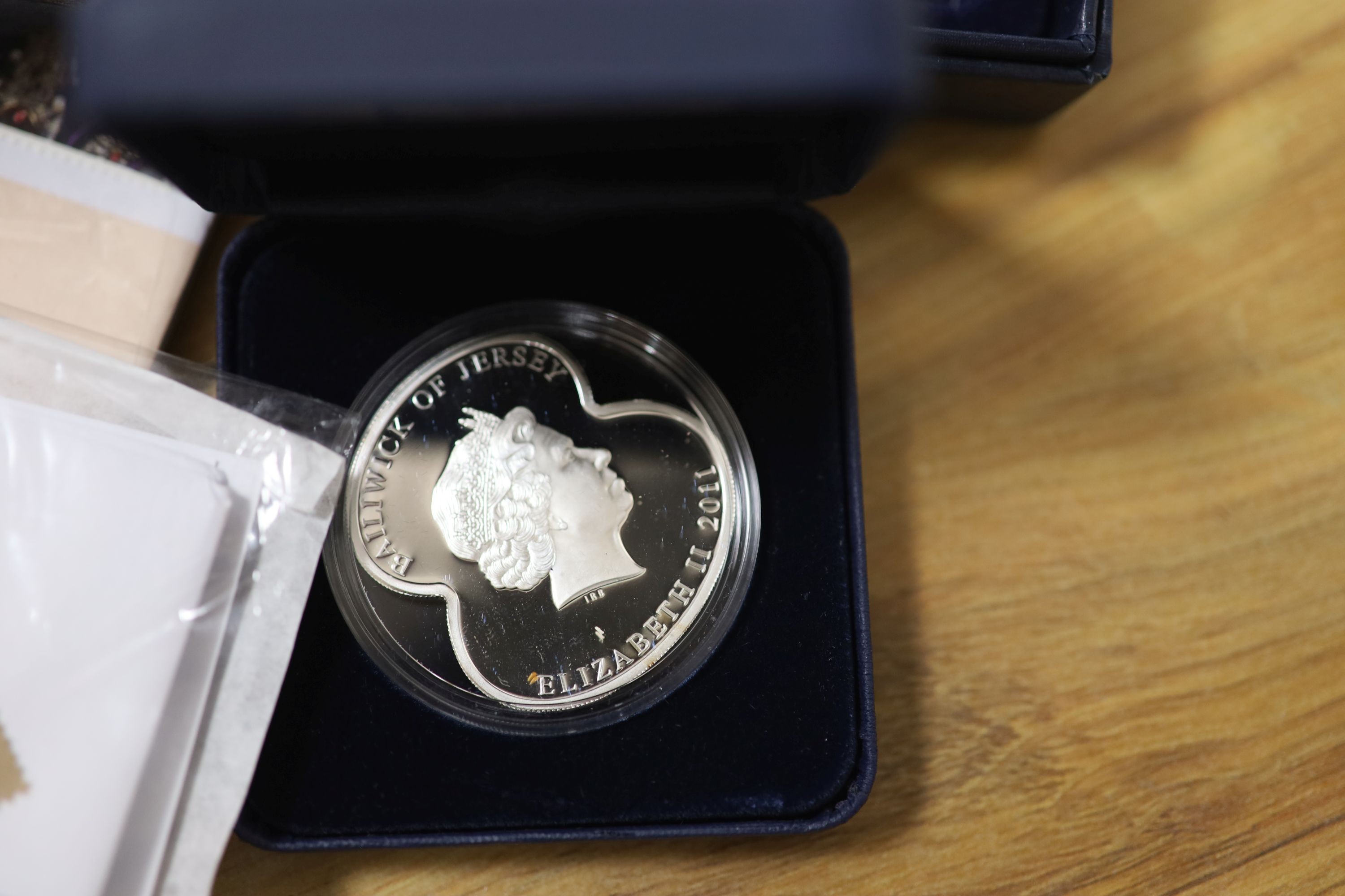 A collection of Westminster & Royal Mint QEII commemorative coins, some silver issues